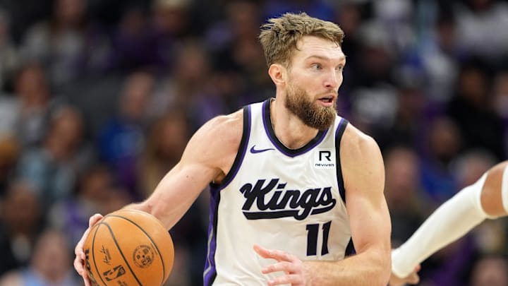 Dec 30, 2024; Sacramento, California, USA; Sacramento Kings forward Domantas Sabonis (11) dribbles against the Dallas Mavericks during the third quarter at Golden 1 Center. Mandatory Credit: Darren Yamashita-Imagn Images
