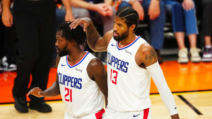 Jun 28, 2021; Phoenix, Arizona, USA; Los Angeles Clippers guard Paul George (13) and Patrick Beverley (21) against the Phoenix Suns in game five of the Western Conference Finals for the 2021 NBA Playoffs at Phoenix Suns Arena. Mandatory Credit: Mark J. Rebilas-Imagn Images