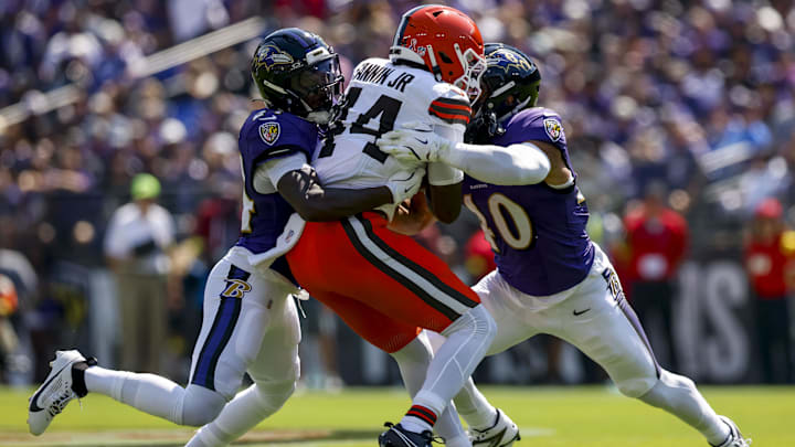 Sep 14, 2025; Baltimore, Maryland, USA; c44 is tackled by Baltimore Ravens linebacker Teddye Buchanan (40) during the first quarter at M&T Bank Stadium. Mandatory Credit: Peter Casey-Imagn Images