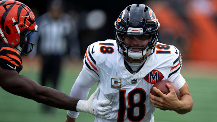 Chicago Bears quarterback Caleb Williams (18) runs by Cincinnati Bengals linebacker Oren Burks (42) in the fourth quarter of the NFL football game between Chicago Bears and Cincinnati Bengals at Paycor Stadium in Cincinnati on Nov. 2, 2025.