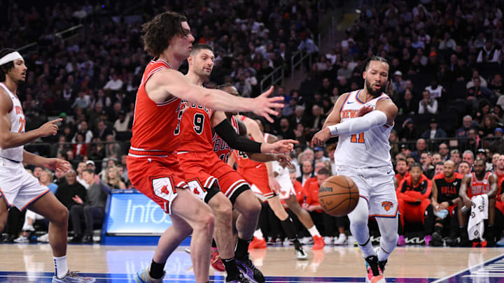 New York Knicks guard Jalen Brunson (11) passes the ball as Chicago Bulls center Nikola Vucevic (9) and Chicago Bulls guard Josh Giddey (3) defend during the first half at Madison Square Garden. Mandatory Credit: John Jones-Imagn Images New York Knicks guard Jalen Brunson (11) passes the ball as Chicago Bulls center Nikola Vucevic (9) and Chicago Bulls guard Josh Giddey (3) defend during the first half at Madison Square Garden. Mandatory Credit: John Jones-Imagn Images