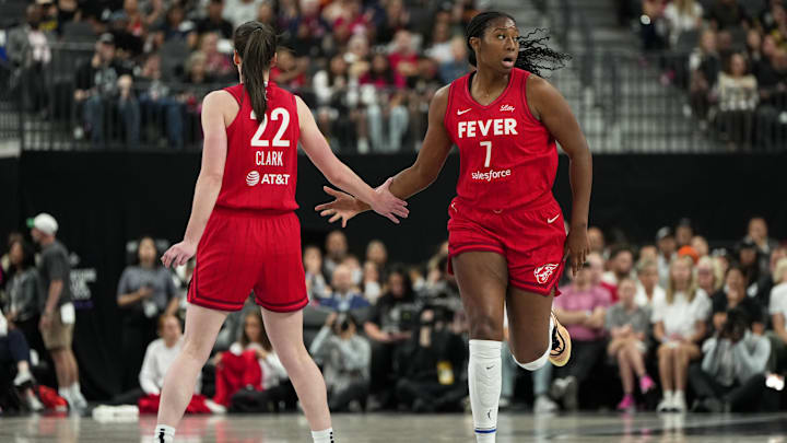Jun 22, 2025; Las Vegas, Nevada, USA; Indiana Fever center Aliyah Boston (7) celebrates with guard Caitlin Clark (22) after scoring against the Las Vegas Aces during the first half of a WNBA basketball game at T-Mobile Arena. Mandatory Credit: Lucas Peltier-Imagn Images