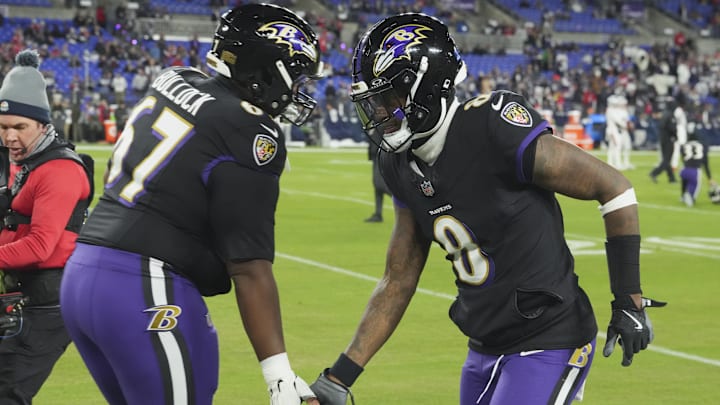 Dec 21, 2025; Baltimore, Maryland, USA;  Baltimore Ravens quarterback Lamar Jackson (8) high fives center Corey Bullock (67) prior to the game against the New England Patriots at M&T Bank Stadium. Mandatory Credit: Mitch Stringer-Imagn Images