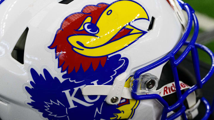Jul 14, 2022; Arlington, TX, USA; A view of the Kansas Jayhawks helmet logo during the Big 12 Media Day at AT&T Stadium. Mandatory Credit: Jerome Miron-Imagn Images