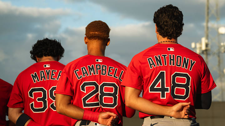 Boston's top-three prospects in Marcelo Mayer, Kristian Campbell and Roman Anthony stand for the national anthem ahead of a Spring Training breakout game on March 13, 2025.