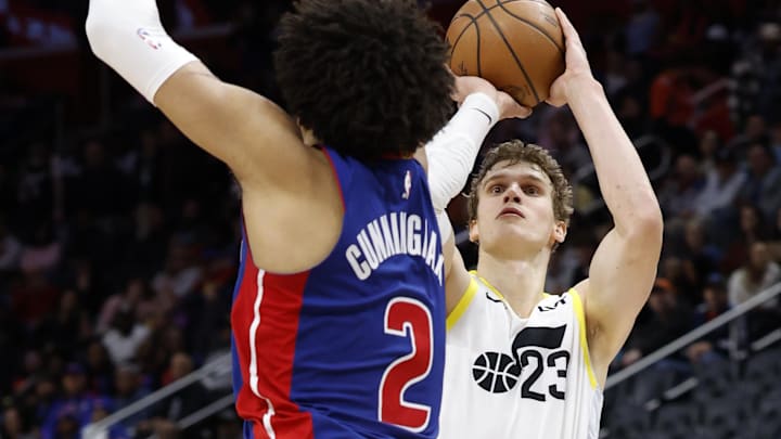 Dec 19, 2024; Detroit, Michigan, USA; Utah Jazz forward Lauri Markkanen (23) shoots on Detroit Pistons guard Cade Cunningham (2) in the third quarter at Little Caesars Arena. Mandatory Credit: Rick Osentoski-Imagn Images Dec 19, 2024; Detroit, Michigan, USA; Utah Jazz forward Lauri Markkanen (23) shoots on Detroit Pistons guard Cade Cunningham (2) in the third quarter at Little Caesars Arena. Mandatory Credit: Rick Osentoski-Imagn Images
