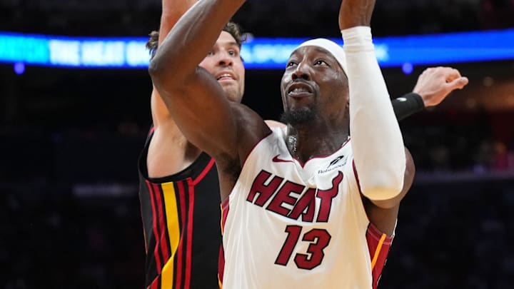 Apr 12, 2026; Miami, Florida, USA; Miami Heat center Bam Adebayo (13) is fouled by Atlanta Hawks forward Corey Kispert (24) on his way to dunk the ball during the second half at Kaseya Center. Mandatory Credit: Jim Rassol-Imagn Images