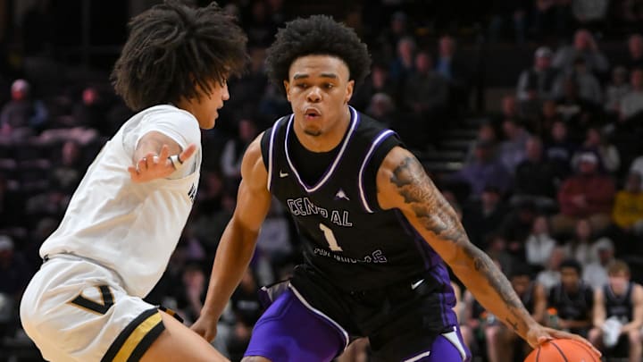 Dec 13, 2025; Nashville, Tennessee, USA;  Central Arkansas Bears guard Camren Hunter (1) dribbles the ball past Vanderbilt Commodores guard Tyler Tanner (3) during the second half at Memorial Gymnasium. Mandatory Credit: Steve Roberts-Imagn Images