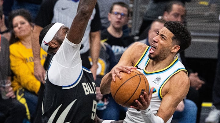 Apr 22, 2025; Indianapolis, Indiana, USA; Indiana Pacers guard Tyrese Haliburton (0) shoots the ball while  Milwaukee Bucks forward Bobby Portis (9) defends during game two of first round for the 2024 NBA Playoffs at Gainbridge Fieldhouse. Mandatory Credit: Trevor Ruszkowski-Imagn Images