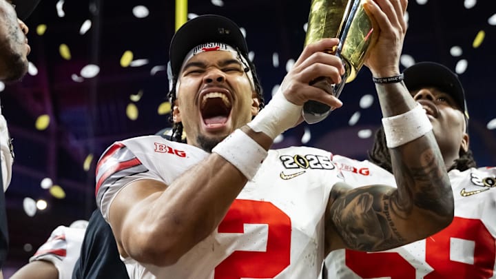 Jan 20, 2025; Atlanta, GA, USA; Ohio State Buckeyes wide receiver Emeka Egbuka (2) celebrates with the trophy after defeating the Notre Dame Fighting Irish during the CFP National Championship college football game at Mercedes-Benz Stadium. Mandatory Credit: Mark J. Rebilas-Imagn Images