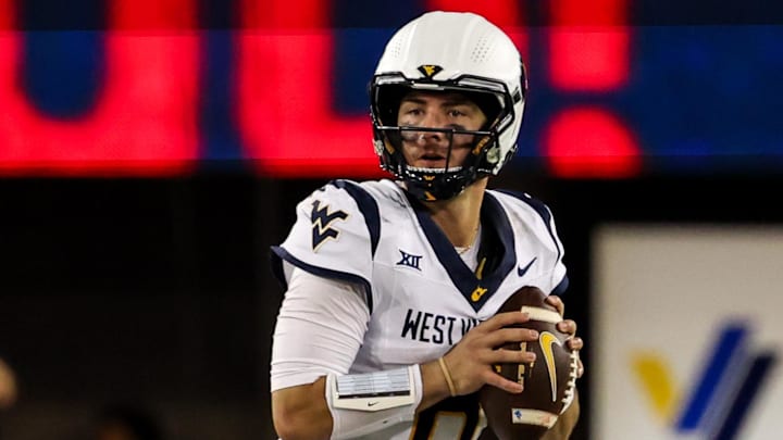 Oct 26, 2024; Tucson, Arizona, USA; West Virginia Mountaineers quarterback Nicco Marchiol (8) looks to throw the ball during the third quarter against the Arizona Wildcats at Arizona Stadium. Mandatory Credit: Aryanna Frank-Imagn Images Oct 26, 2024; Tucson, Arizona, USA; West Virginia Mountaineers quarterback Nicco Marchiol (8) looks to throw the ball during the third quarter against the Arizona Wildcats at Arizona Stadium. Mandatory Credit: Aryanna Frank-Imagn Images