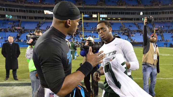 Dec 15, 2013; Charlotte, NC, USA; Carolina Panthers quarterback Cam Newton (1) with New York Jets quarterback Geno Smith (7) after the game. The Panthers defeated the Jets 30-20 at Bank of America Stadium. 