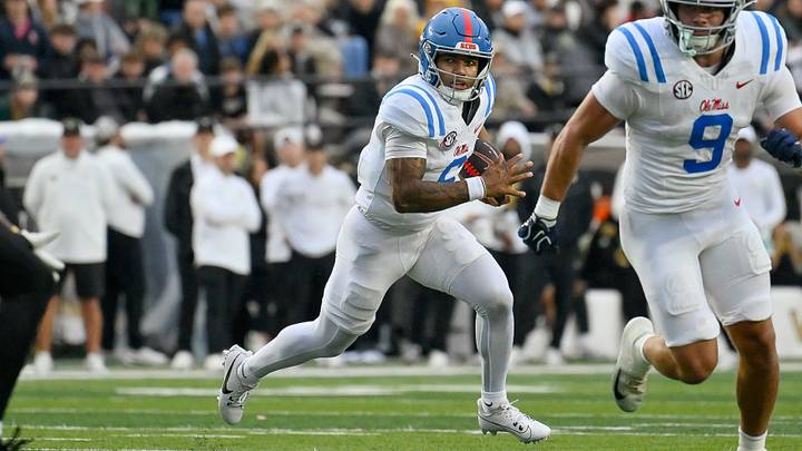Mississippi Rebels quarterback Trinidad Chambliss runs with the ball against the Vanderbilt Commodores Mississippi Rebels quarterback Trinidad Chambliss runs with the ball against the Vanderbilt Commodores