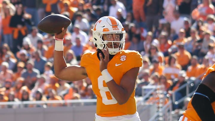 Nov 4, 2023; Knoxville, Tennessee, USA; Tennessee Volunteers quarterback Nico Iamaleava (8) throws his first career touchdown pass during the second half against the Connecticut Huskies at Neyland Stadium. Mandatory Credit: Randy Sartin-Imagn Images