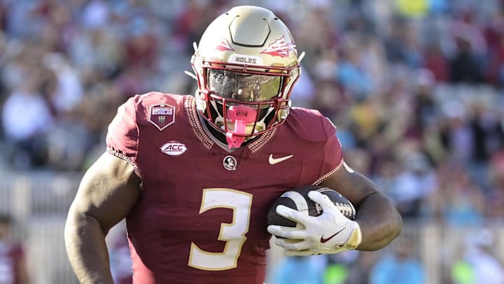 Nov 23, 2024; Tallahassee, Florida, USA; Florida State Seminoles running back Kam Davis (3) runs the ball during the second half of the game against the Charleston Southern Buccaneers at Doak S. Campbell Stadium. Mandatory Credit: Melina Myers-Imagn Images