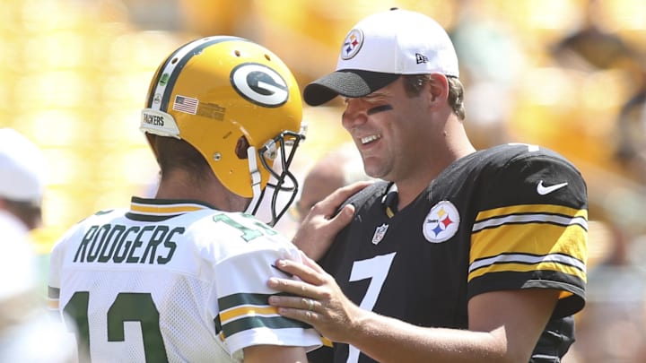 Green Bay Packers quarterback Aaron Rodgers and Pittsburgh Steelers quarterback Ben Roethlisberger talk at midfield before their game at Heinz Field in 2015. Rodgers, the Steelers' current starting quarterback, led the Packers to a win over Roethlisberger's Pittsburgh club in Super Bowl XLV.