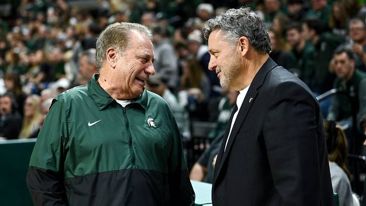 Michigan State's head coach Tom Izzo, left, talks with Oakland's head coach Greg Kampe before the game on Monday, Dec. 18, 2023, at the Breslin Center in East Lansing. \"They get their players going, the level of intensity just ratchets up and there's nothing you can do about it as a visiting player or team,\" Said Kampe of the Izzone impact.