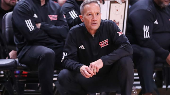 Texas Tech head coach Grant McCasland crouches on the sideline during a Big 12 Conference men's basketball game, Saturday, Jan. 24, 2026, in United Supermarkets Arena.