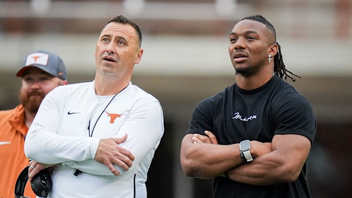 Texas Longhorns Head Coach Steve Sarkisian and former Longhorn Bijan Robinson watch the Longhorns' spring Orange and White game at Darrell K Royal Texas Memorial Stadium in Austin, Texas, April 20, 2024.