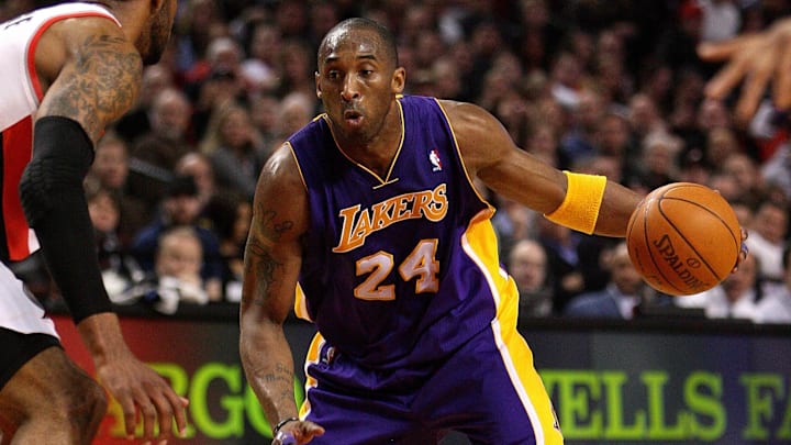 Feb. 23, 2011; Portland, OR, USA;  Los Angeles Lakers shooting guard Kobe Bryant (24) drives past Portland Trailblazers power forward LaMarcus Aldridge (12) at the Rose Garden. Mandatory Credit: Craig Mitchelldyer-Imagn Images