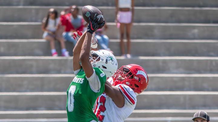 Receiver Isaiah Grant (Lincoln-San Diego) has a pass broken up by Arbor View defensive back Damien Dixon in California. 