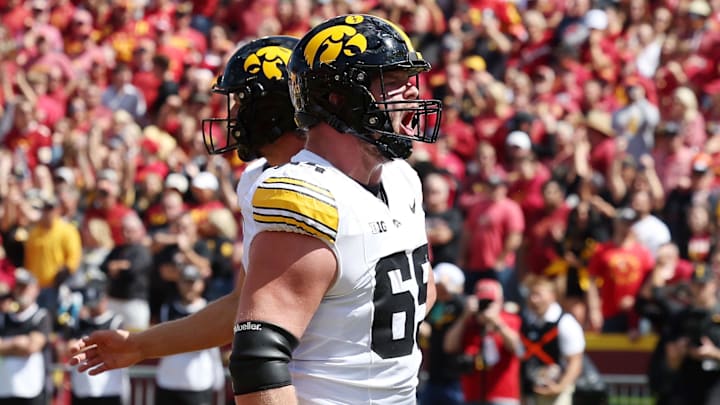 Sep 6, 2025; Ames, Iowa, USA; Iowa Hawkeyes offensive lineman Logan Jones (65) reacts after a play against the Iowa State Cyclones during the second half at Jack Trice Stadium. Mandatory Credit: Reese Strickland-Imagn Images