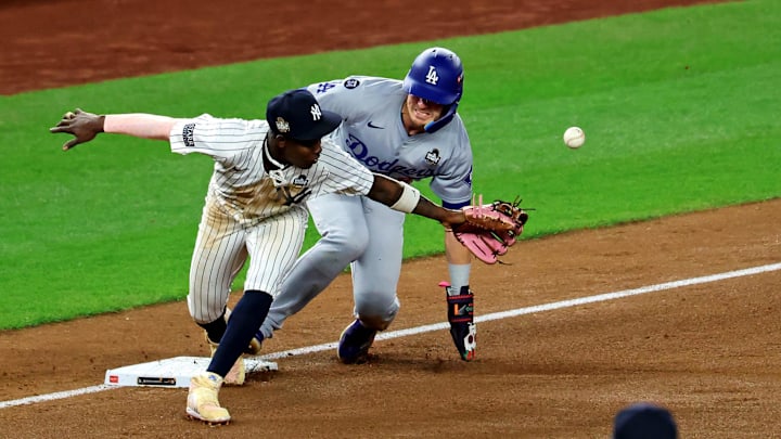Oct 30, 2024; Bronx, New York, USA; Los Angeles Dodgers third baseman Enrique Hernandez (8) reaches third base after an error by New York Yankees third baseman Jazz Chisholm Jr. (13) during the fifth inning during game five of the 2024 MLB World Series at Yankee Stadium. Mandatory Credit: James Lang-Imagn Images Oct 30, 2024; Bronx, New York, USA; Los Angeles Dodgers third baseman Enrique Hernandez (8) reaches third base after an error by New York Yankees third baseman Jazz Chisholm Jr. (13) during the fifth inning during game five of the 2024 MLB World Series at Yankee Stadium. Mandatory Credit: James Lang-Imagn Images
