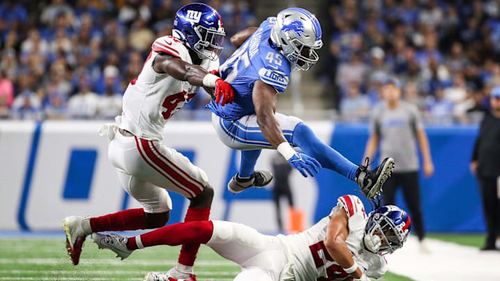 Detroit Lions fullback Jason Cabinda (45) makes a catch against New York Giants linebacker Cam Brown (47) and safety Dane Belton (24) during the first half of a preseason game at Ford Field in Detroit on Friday, Aug. 11, 2023. Detroit Lions fullback Jason Cabinda (45) makes a catch against New York Giants linebacker Cam Brown (47) and safety Dane Belton (24) during the first half of a preseason game at Ford Field in Detroit on Friday, Aug. 11, 2023.