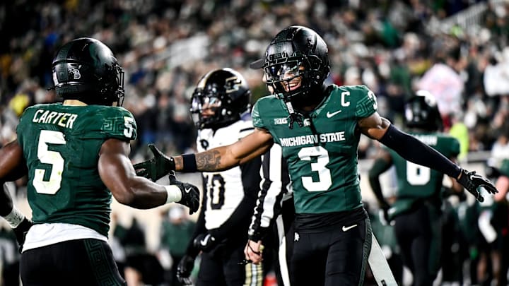 Michigan State's Montorie Foster Jr., right, celebrates with Nathan Carter, left, after Carter's touchdown against Purdue during the second quarter on Friday, Nov. 22, 2024, at Spartan Stadium in East Lansing.