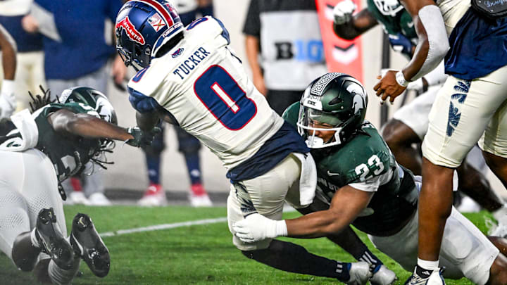 Michigan State's Darius Snow, right, tackles Florida Atlantic's Milan Tucker during the second quarter on Friday, Aug. 30, 2024, at Spartan Stadium in East Lansing. Michigan State's Darius Snow, right, tackles Florida Atlantic's Milan Tucker during the second quarter on Friday, Aug. 30, 2024, at Spartan Stadium in East Lansing.