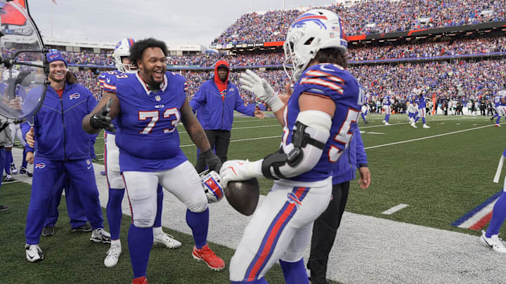Buffalo Bills offensive tackle Dion Dawkins (73) celebrates with Buffalo Bills linebacker Matt MilanoÕs (58).