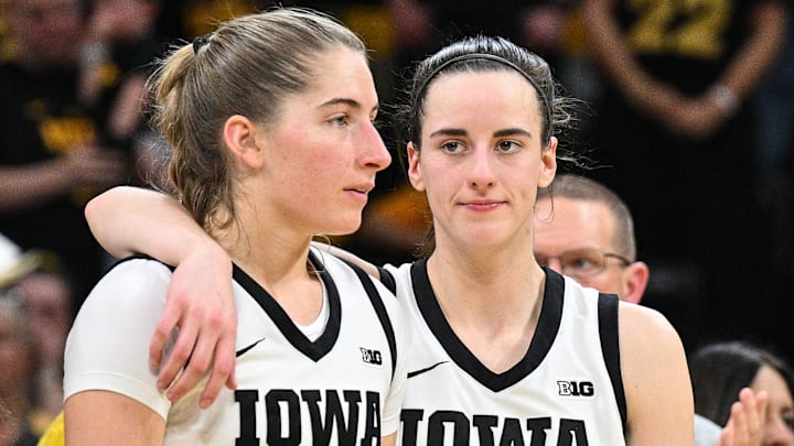 Mar 3, 2024; Iowa City, Iowa, USA; Iowa Hawkeyes guard Caitlin Clark (22) reacts with guard Kate Martin (20) during senior day after the game against the Ohio State Buckeyes. Clark broke the NCAA basketball all-time scoring record during the second quarter. Mandatory Credit: Jeffrey Becker-Imagn Images Mar 3, 2024; Iowa City, Iowa, USA; Iowa Hawkeyes guard Caitlin Clark (22) reacts with guard Kate Martin (20) during senior day after the game against the Ohio State Buckeyes. Clark broke the NCAA basketball all-time scoring record during the second quarter. Mandatory Credit: Jeffrey Becker-Imagn Images