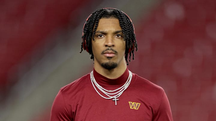Jan 12, 2025; Tampa, Florida, USA; Washington Commanders quarterback Jayden Daniels (5) warms up before a NFC wild card playoff against the Tampa Bay Buccaneers at Raymond James Stadium. Mandatory Credit: Nathan Ray Seebeck-Imagn Images