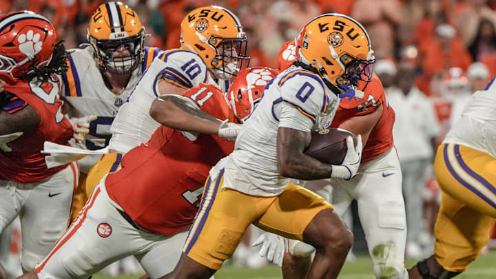 Louisiana State University receiver Zavion Thomas (0) runs near Clemson defensive lineman Peter Woods (11) during the first quarter at Memorial Stadium in Clemson, S.C. Saturday, August 30, 2025. Louisiana State University receiver Zavion Thomas (0) runs near Clemson defensive lineman Peter Woods (11) during the first quarter at Memorial Stadium in Clemson, S.C. Saturday, August 30, 2025.