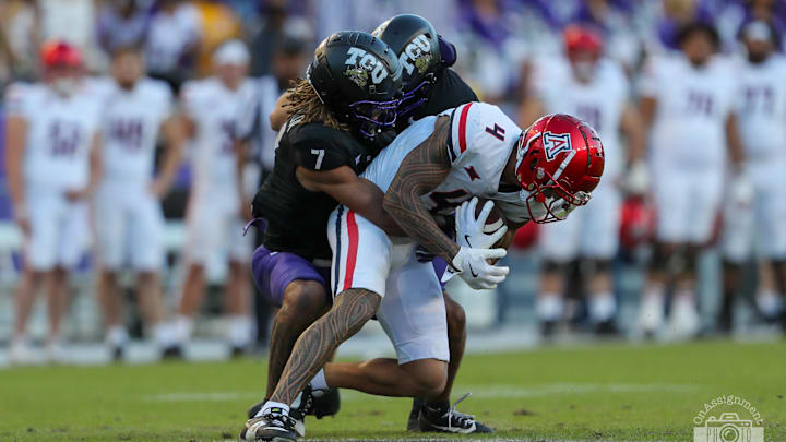 Channing Canada prevents Tetairoa McMillan from getting a first down after a completed pass. 