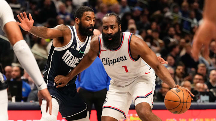 Dec 21, 2024; Dallas, Texas, USA;  LA Clippers guard James Harden (1) drives to the basket ahead of Dallas Mavericks guard Kyrie Irving (11) during the first half at American Airlines Center. Mandatory Credit: Chris Jones-Imagn Images
