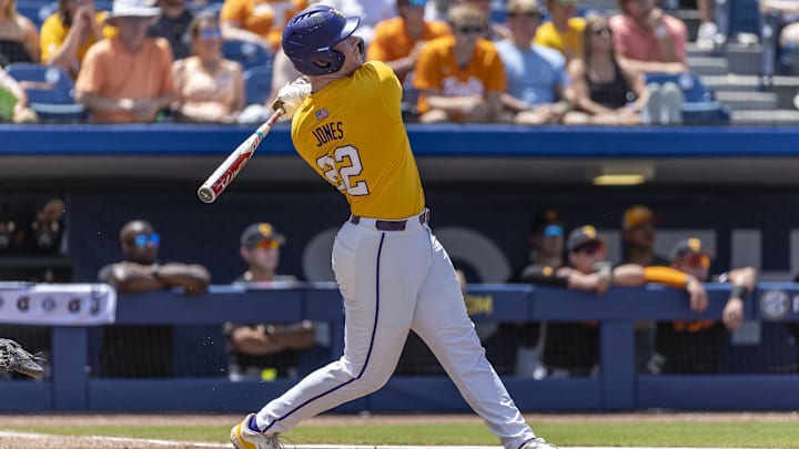 May 26, 2024; Hoover, AL, USA; LSU Tigers infielder Jared Jones (22) hits a solo home run against the Tennessee Volunteers during the championship game between Tennessee and LSU at the SEC Baseball Tournament at Hoover Metropolitan Stadium. Mandatory Credit: Vasha Hunt-Imagn Images May 26, 2024; Hoover, AL, USA; LSU Tigers infielder Jared Jones (22) hits a solo home run against the Tennessee Volunteers during the championship game between Tennessee and LSU at the SEC Baseball Tournament at Hoover Metropolitan Stadium. Mandatory Credit: Vasha Hunt-Imagn Images