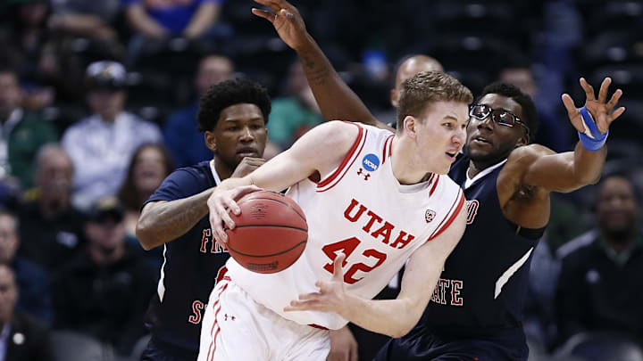 Utah Utes forward Jakob Poeltl (42) drives against Fresno State Bulldogs forward Karachi Edo (4) in the first half of Utah vs Fresno State in the first round of the 2016 NCAA Tournament at Pepsi Center.