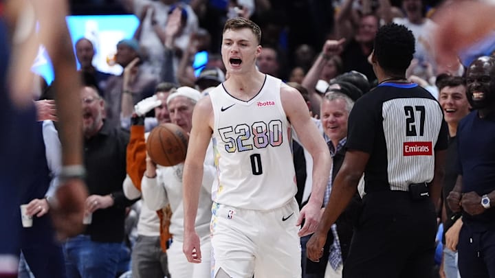 Apr 29, 2025; Denver, Colorado, USA; Denver Nuggets guard Christian Braun (0) reacts in the fourth quarter against the LA Clippers during game five of the first round for the 2025 NBA Playoffs at Ball Arena. Mandatory Credit: Ron Chenoy-Imagn Images