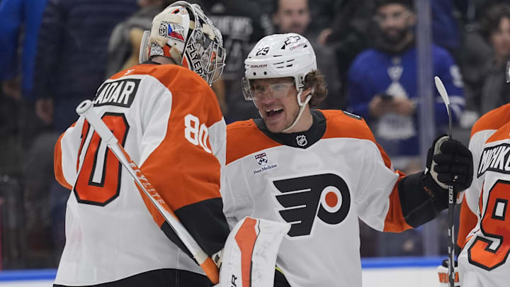 Mar 2, 2026; Toronto, Ontario, CAN; Philadelphia Flyers forward Nikita Grebenkin (29) and goaltender Dan Vladar (80) celebrate a win over the Toronto Maple Leafs in an overtime shoot out at Scotiabank Arena.