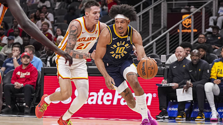 Oct 8, 2024; Atlanta, Georgia, USA; Indiana Pacers guard Kendall Brown (10) dribbles past Atlanta Hawks guard Vit Krejci (27) during the second half at State Farm Arena. Mandatory Credit: Dale Zanine-Imagn Images