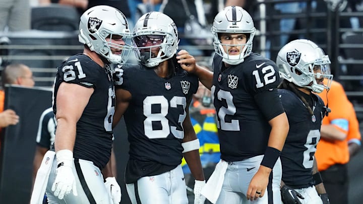 Oct 13, 2024; Paradise, Nevada, USA; Las Vegas Raiders wide receiver Kristian Wilkerson (83) celebrates with guard Jordan Meredith (61) and quarterback Aidan O'Connell (12) after scoring a touchdown against the Pittsburgh Steelers during the fourth quarter at Allegiant Stadium. Mandatory Credit: Stephen R. Sylvanie-Imagn Images Oct 13, 2024; Paradise, Nevada, USA; Las Vegas Raiders wide receiver Kristian Wilkerson (83) celebrates with guard Jordan Meredith (61) and quarterback Aidan O'Connell (12) after scoring a touchdown against the Pittsburgh Steelers during the fourth quarter at Allegiant Stadium. Mandatory Credit: Stephen R. Sylvanie-Imagn Images