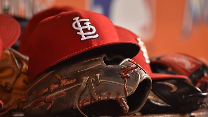 Jul 29, 2016; Miami, FL, USA; A detailed view of a hat and glove in the dugout of the St. Louis Cardinals in the game against the Miami Marlins at Marlins Park. The Cardinals defeated the Marlins 11-6. Mandatory Credit: Jasen Vinlove-Imagn Images Jul 29, 2016; Miami, FL, USA; A detailed view of a hat and glove in the dugout of the St. Louis Cardinals in the game against the Miami Marlins at Marlins Park. The Cardinals defeated the Marlins 11-6. Mandatory Credit: Jasen Vinlove-Imagn Images