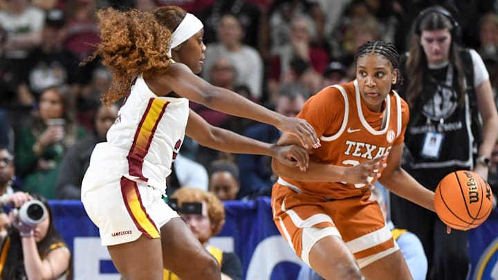 South Carolina Gamecocks guard Raven Johnson (25) defends Texas Longhorns forward Madison Booker (35) Sunday, March 8, 2026, during the SEC Women's Basketball Tournament Championship game at Bon Secours Wellness Arena in Greenville, South Carolina.