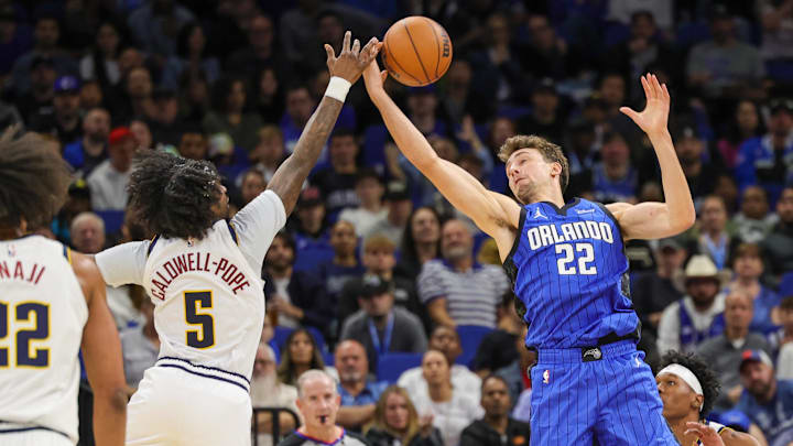 Nov 22, 2023; Orlando, Florida, USA; Orlando Magic forward Franz Wagner (22) and Denver Nuggets