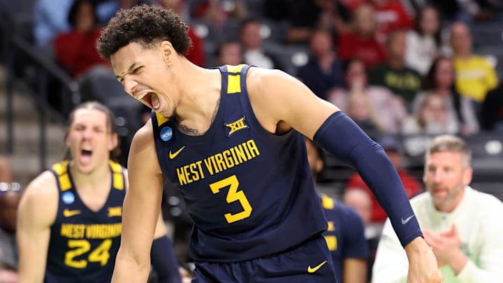 Mar 16, 2023; Birmingham, AL, USA; West Virginia Mountaineers forward Tre Mitchell (3) reacts after scoring a basket while being fouled against the Maryland Terrapins during the second half in the first round of the 2023 NCAA Tournament at Legacy Arena. Mandatory Credit: Vasha Hunt-Imagn Images