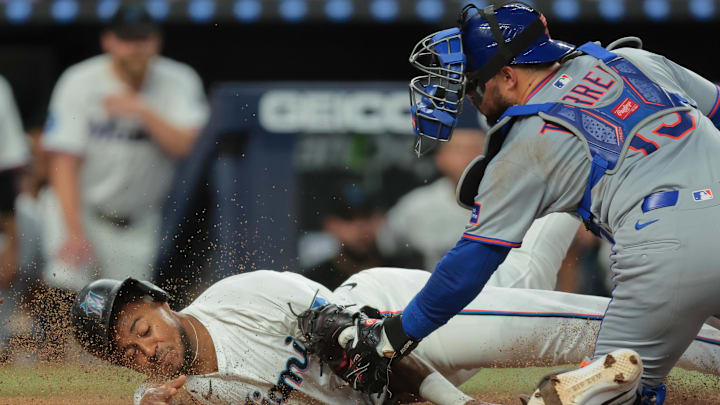Apr 2, 2025; Miami, Florida, USA; New York Mets catcher Luis Torrens (13) tags out Miami Marlins pinch runner Dane Myers (54) during the tenth inning at loanDepot Park. Mandatory Credit: Sam Navarro-Imagn Images Apr 2, 2025; Miami, Florida, USA; New York Mets catcher Luis Torrens (13) tags out Miami Marlins pinch runner Dane Myers (54) during the tenth inning at loanDepot Park. Mandatory Credit: Sam Navarro-Imagn Images