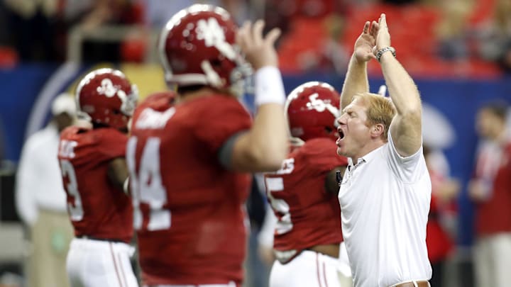 Dec 5, 2015; Atlanta, GA, USA; Alabama Crimson Tide assistant coach Scott Cochran leads the team during warm-up drill prior to facing the Florida Gators in the 2015 SEC Championship Game at the Georgia Dome. 