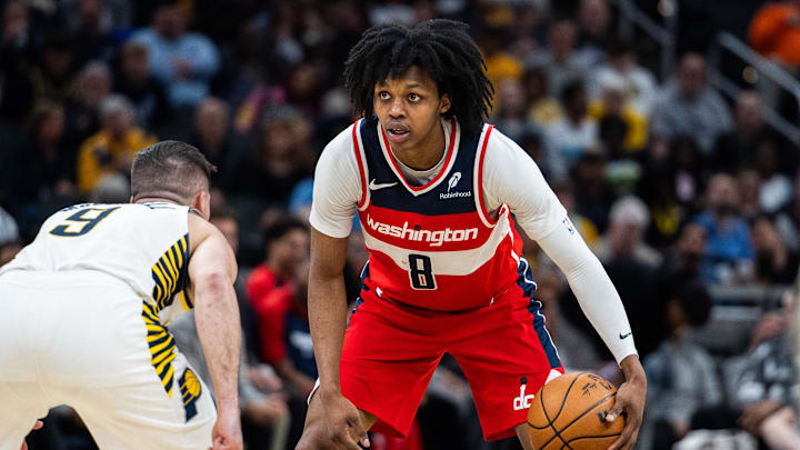 Apr 8, 2025; Indianapolis, Indiana, USA; Washington Wizards guard Bub Carrington (8) dribbles the ball while  Indiana Pacers guard T.J. McConnell (9) defends in the second half at Gainbridge Fieldhouse. Mandatory Credit: Trevor Ruszkowski-Imagn Images