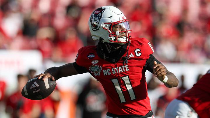 Dec 19, 2025; Tampa, FL, USA; NC State Wolfpack quarterback CJ Bailey (11) throws a pass against the Memphis Tigers in the second quarter during the Gasparilla Bowl at Raymond James Stadium. Mandatory Credit: Nathan Ray Seebeck-Imagn Images Dec 19, 2025; Tampa, FL, USA; NC State Wolfpack quarterback CJ Bailey (11) throws a pass against the Memphis Tigers in the second quarter during the Gasparilla Bowl at Raymond James Stadium. Mandatory Credit: Nathan Ray Seebeck-Imagn Images